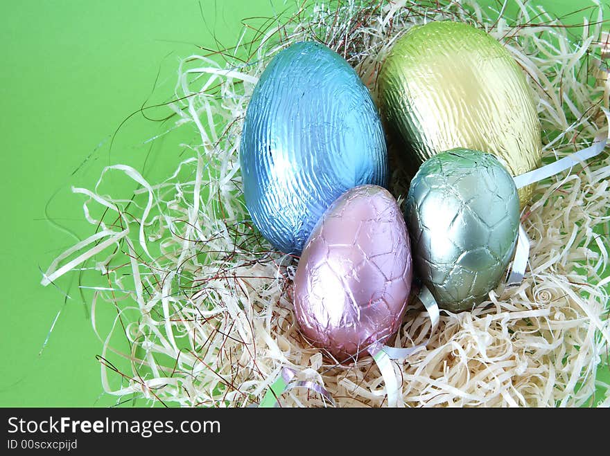 Assortment of chocolate Easter eggs wrapped in colorful paper. Assortment of chocolate Easter eggs wrapped in colorful paper