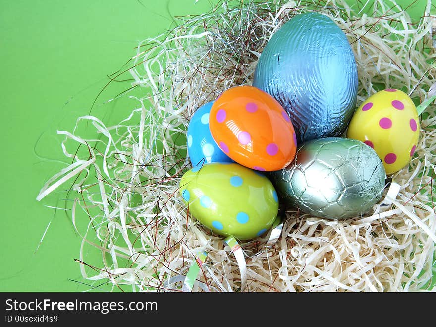 Assortment of chocolate Easter eggs wrapped in colorful paper. Assortment of chocolate Easter eggs wrapped in colorful paper