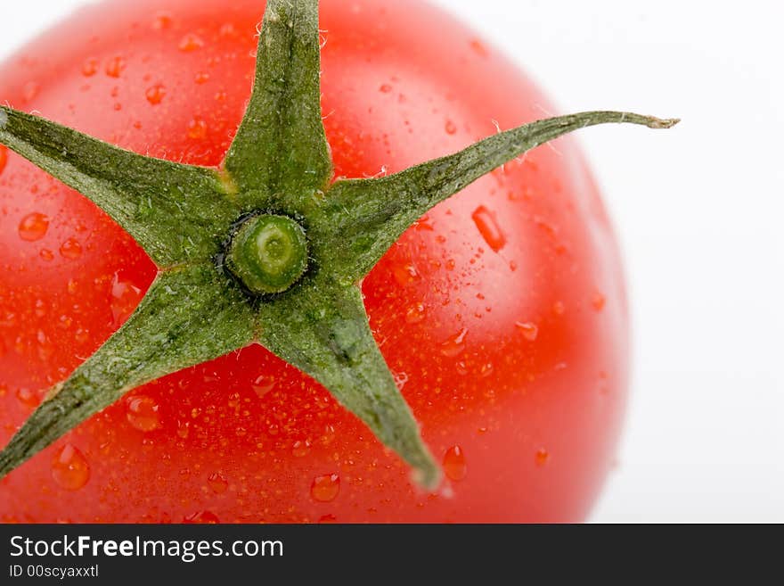 Macro wet red fresh tomato on white