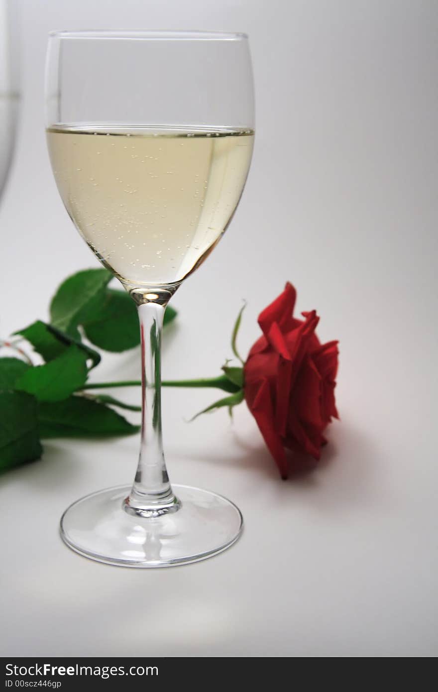 White wine and red rose