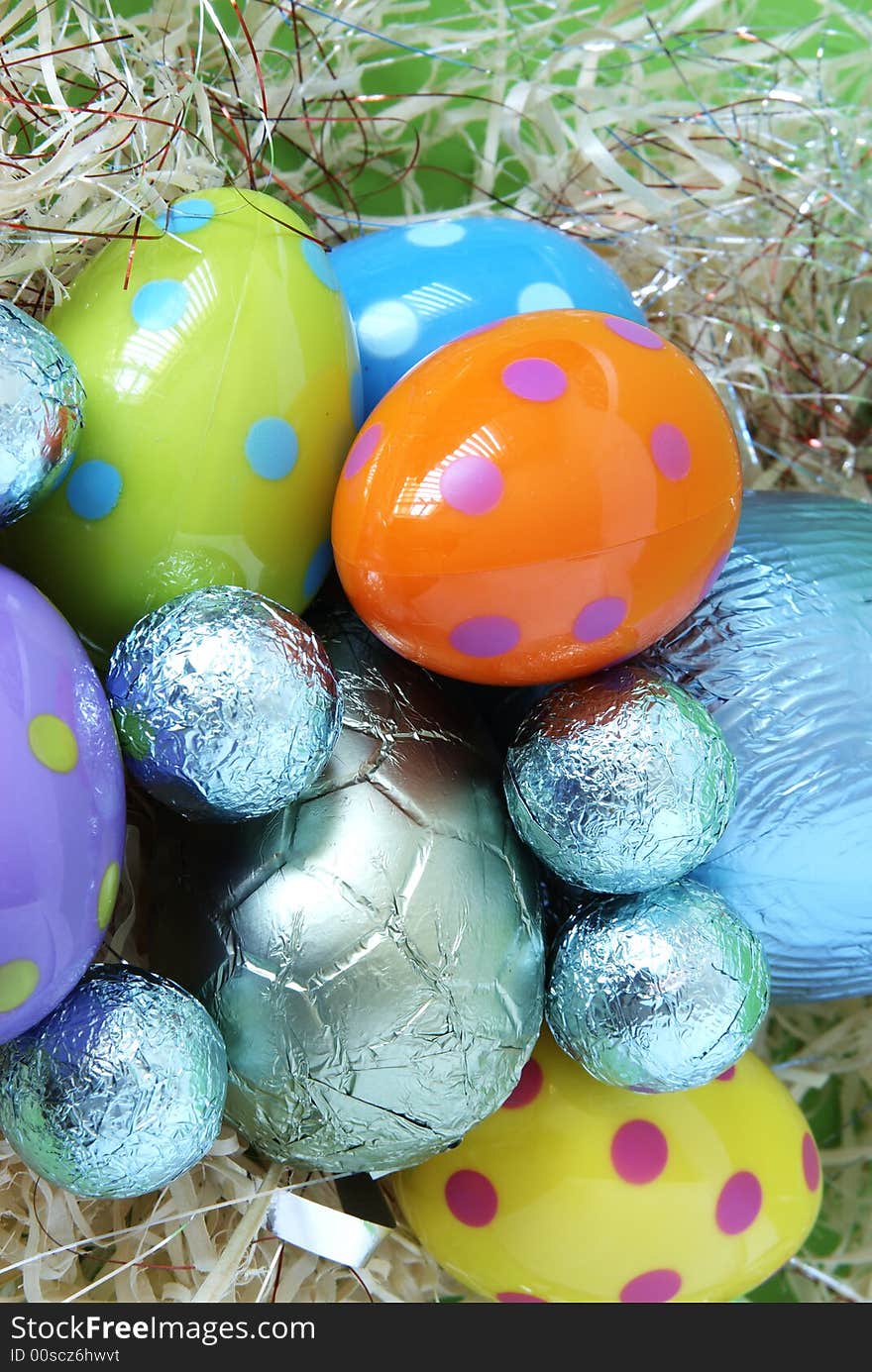 Assortment of chocolate Easter eggs wrapped in colorful paper. Assortment of chocolate Easter eggs wrapped in colorful paper