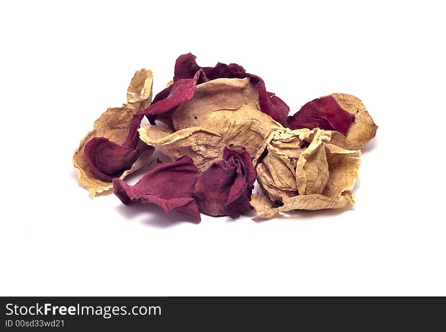 A pile of dried rose petals isolated on white.