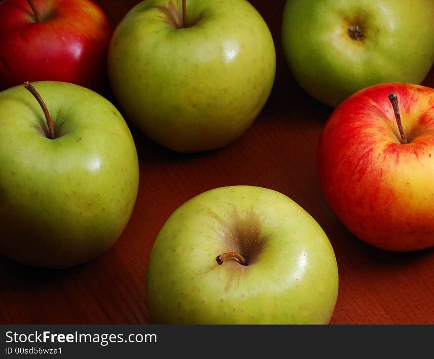 Group of colored apples on the dark background