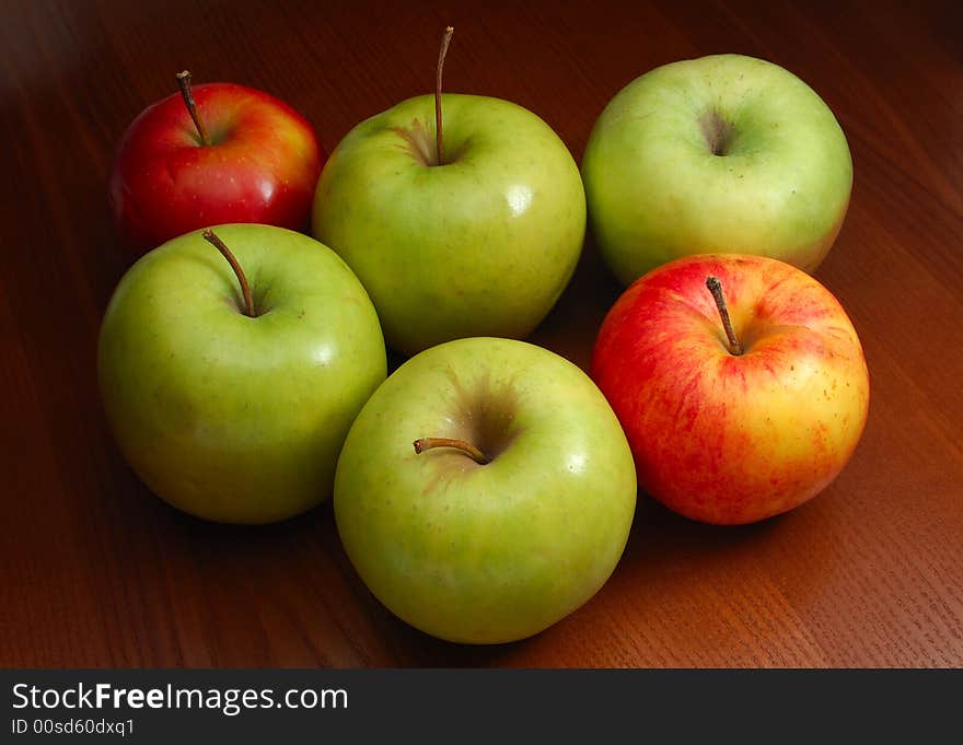 Group of colored apples on the dark background