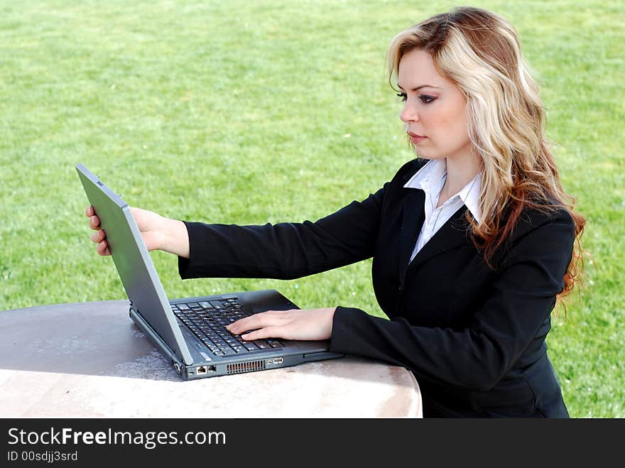 Portrait of a confident and successful businesswoman with a laptop. Portrait of a confident and successful businesswoman with a laptop