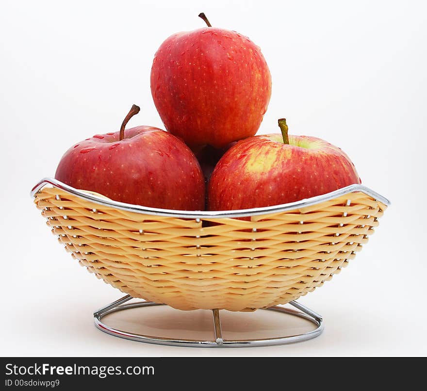 Fresh red apples with water drops on them