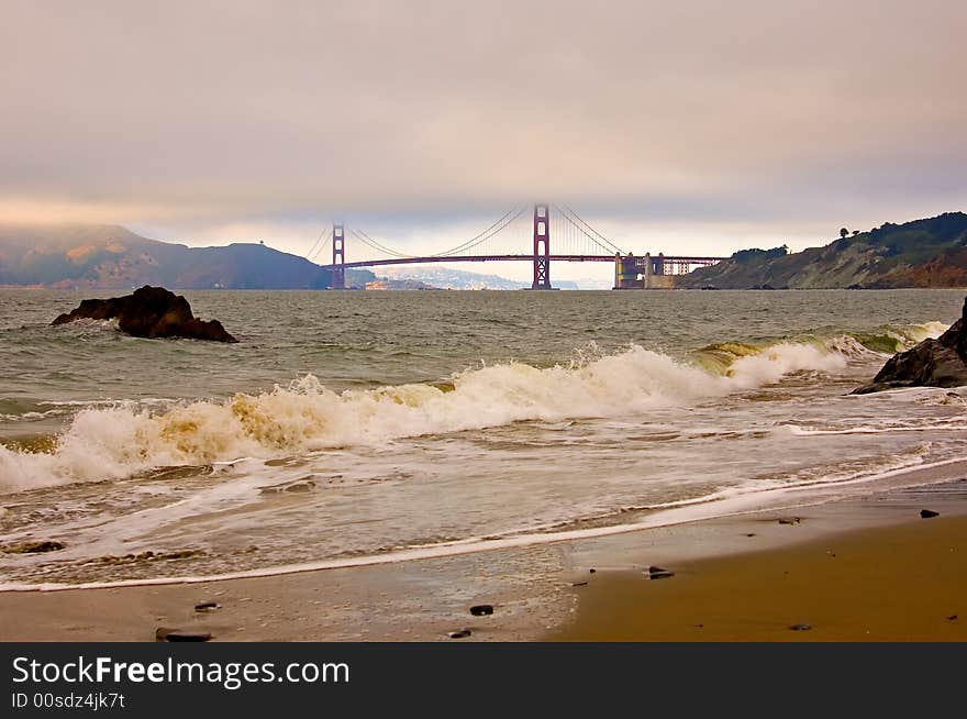 Golden Gate Bridge in a fog at sunset