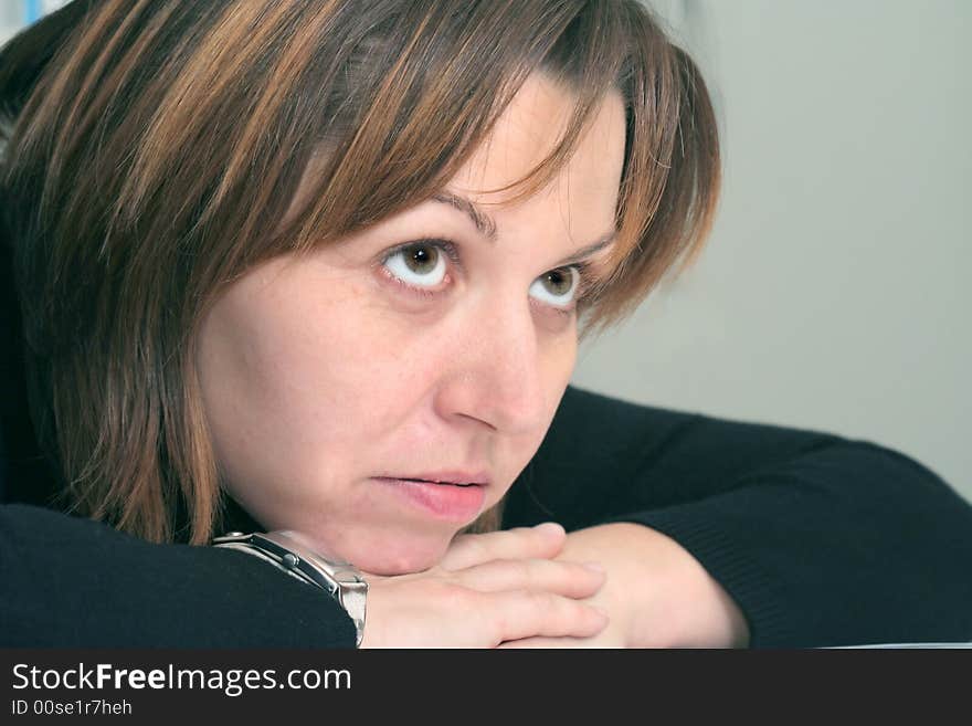 Woman resting her head on hands