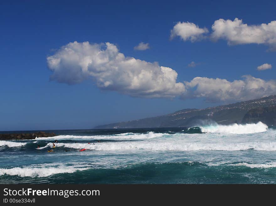 Sea shore with waves and nice clouds above. Sea shore with waves and nice clouds above