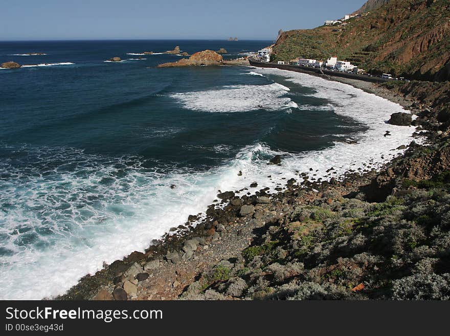 Stone coast with white waves. Canary Islands. Stone coast with white waves. Canary Islands