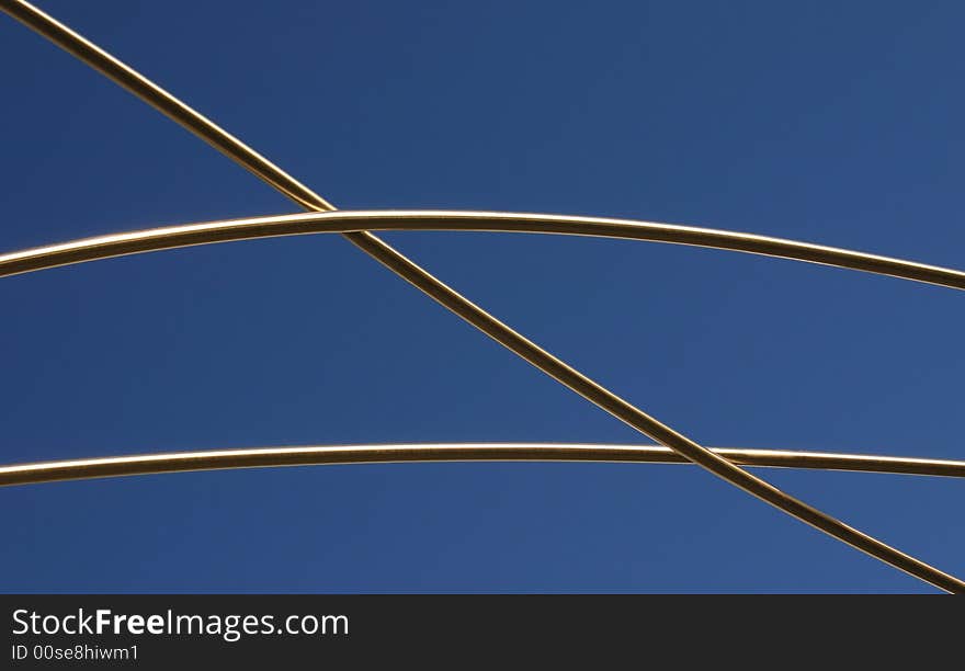 - a bent metal structure against blue sky