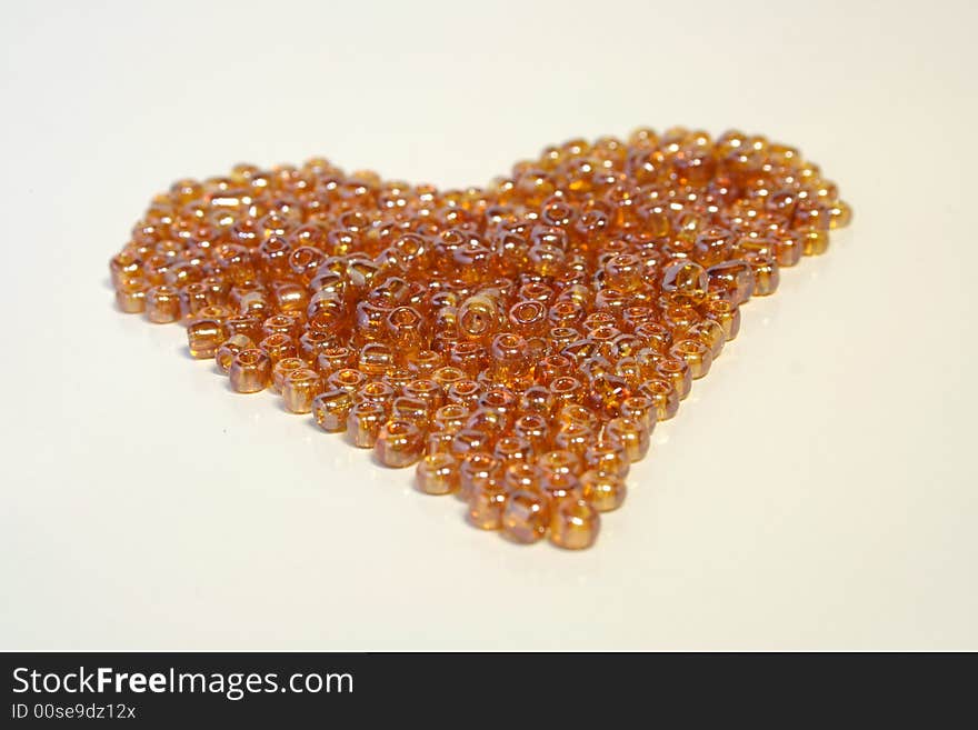 Golden beads laying together on the table