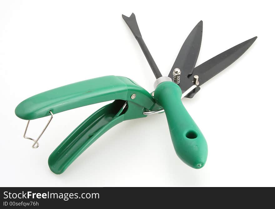 Gardening tools weed clippers and weed digger white background. Gardening tools weed clippers and weed digger white background