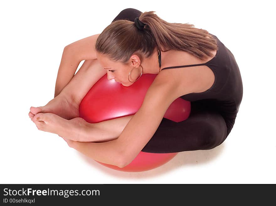 A young girl exercise with ball rollout. A young girl exercise with ball rollout