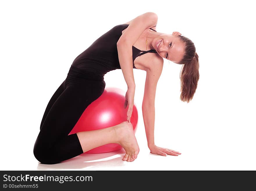 A young girl exercise with ball rollout. A young girl exercise with ball rollout