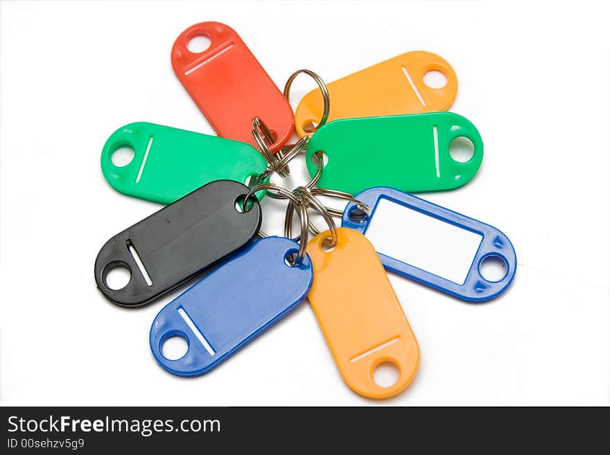 Multicolored plastic trinkets on a white background