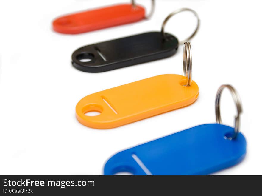 Multicolored plastic trinkets on a white background