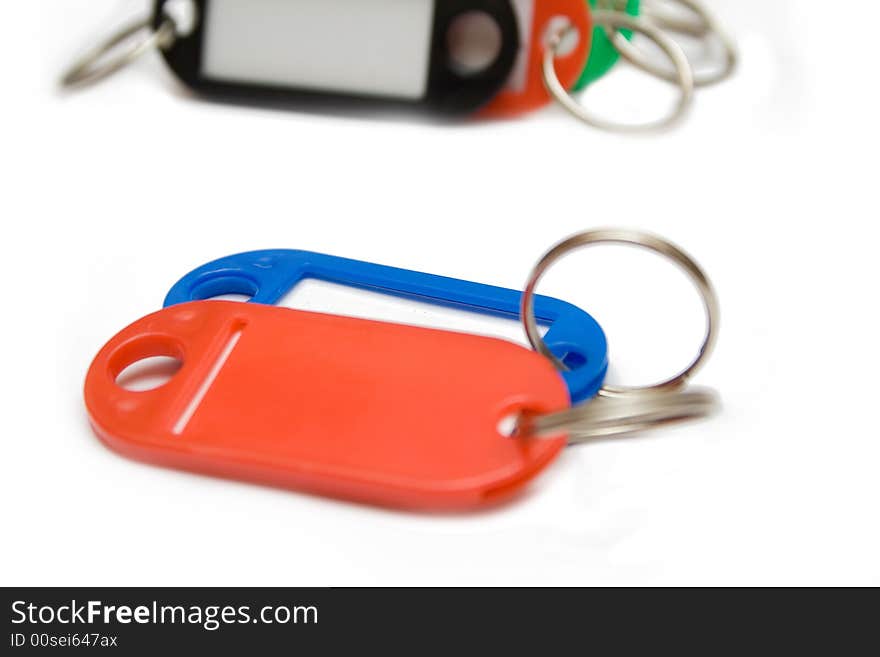 Multicolored plastic trinkets on white background