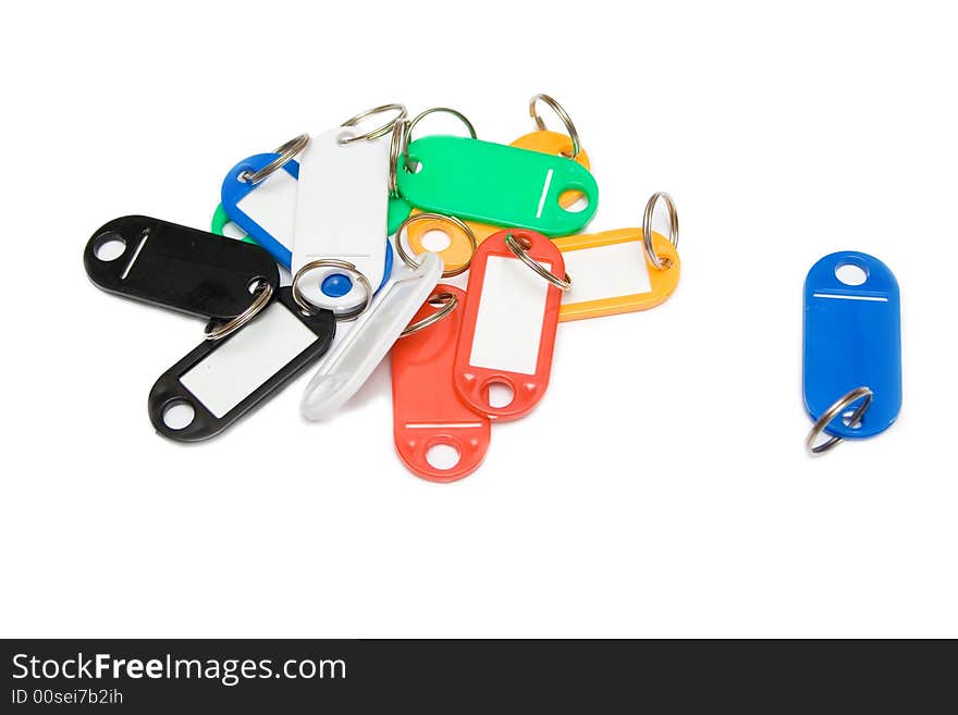 Multicolored plastic trinkets on a white background