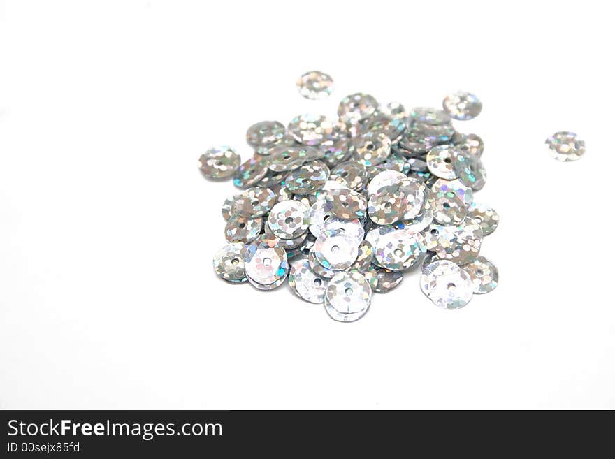 Silver confettis on the isolated background