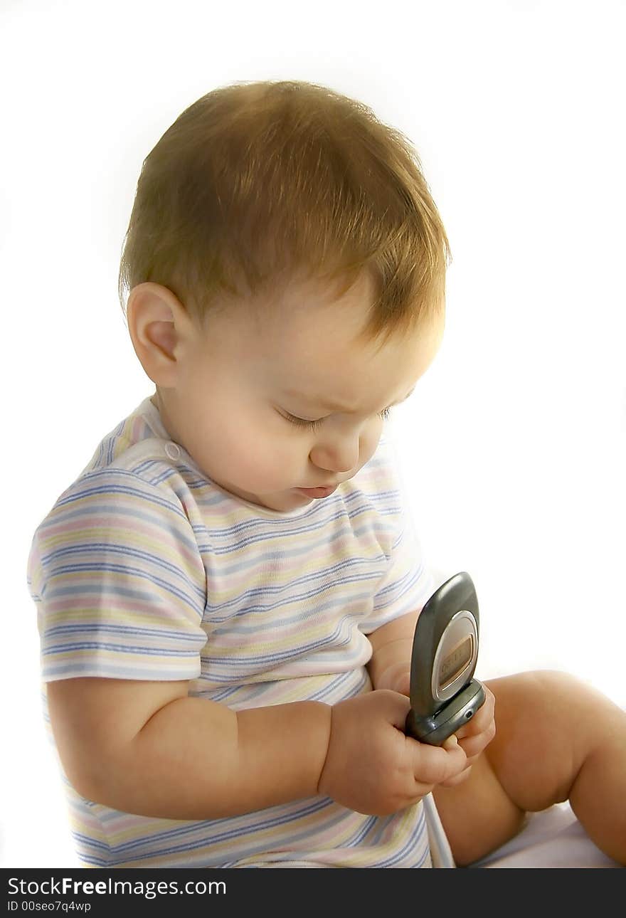 Baby boy with cell phone over white