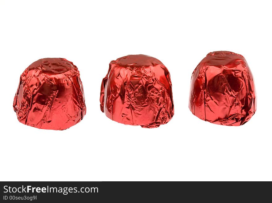 Three red chocolates isolated on white. Three red chocolates isolated on white