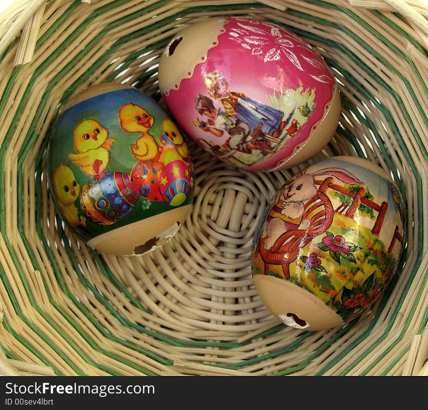 Three decorated Easter eggs in a basket. Three decorated Easter eggs in a basket