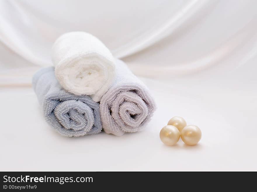 SPA Items - towels and soap bowls on a white background