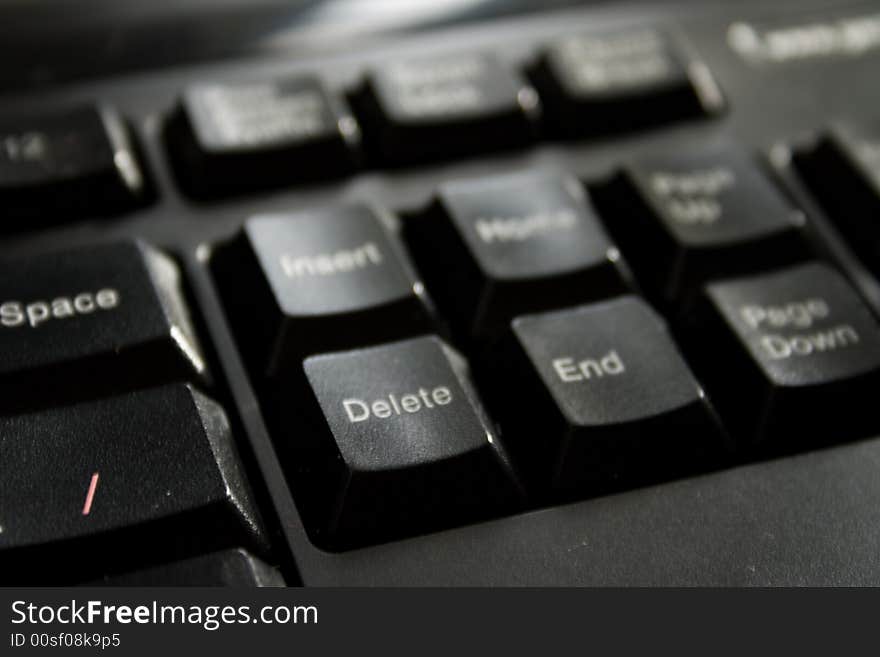 Part of black keyboard in sun light