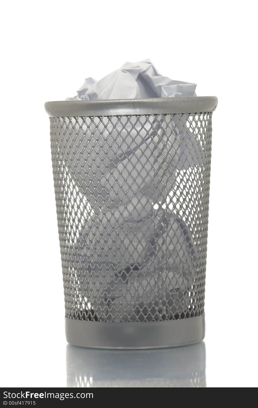 Mesh trash bin full of crumpled paper. Mesh trash bin full of crumpled paper