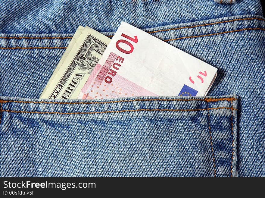 Euro and dollar in a trousers pocket. Euro and dollar in a trousers pocket