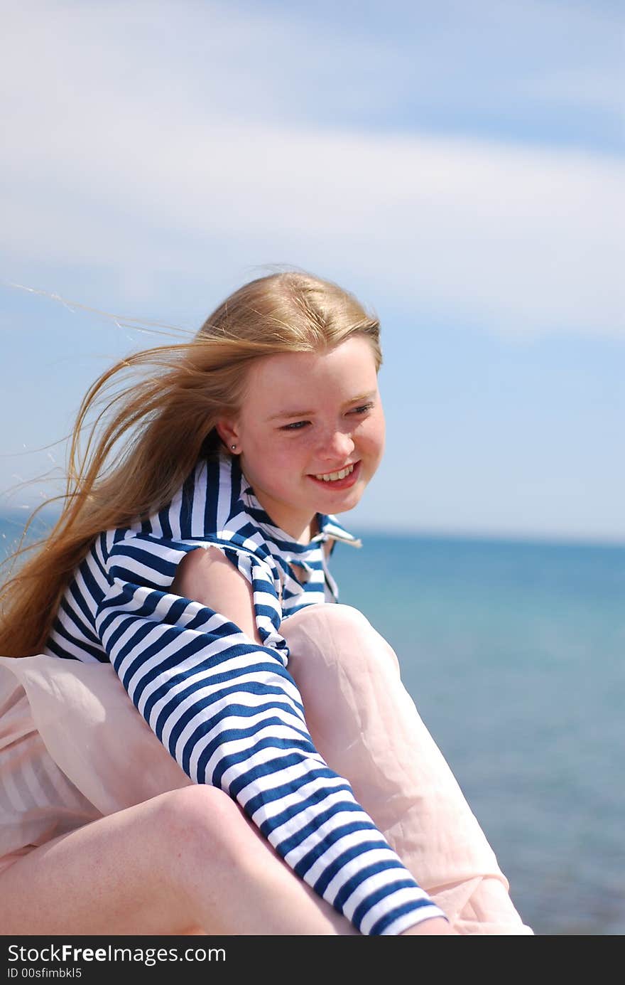 Blondy girl in sailor's striped vest. Blondy girl in sailor's striped vest