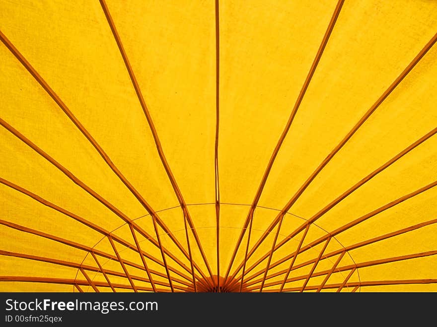 A detail image of a yellow parasol