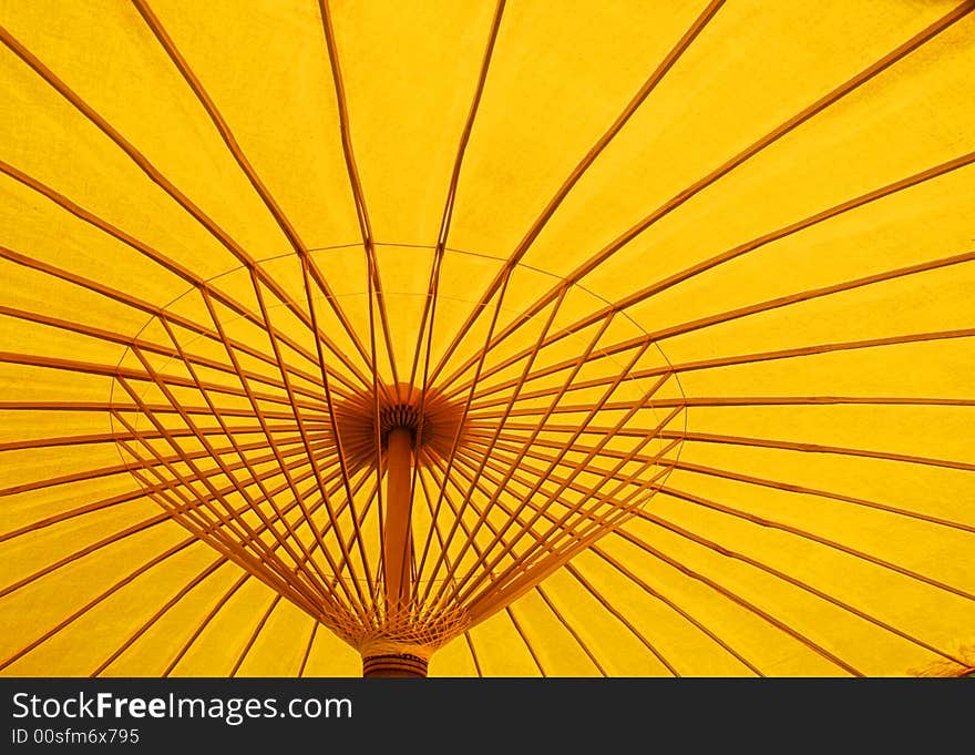 A detail image of a yellow parasol