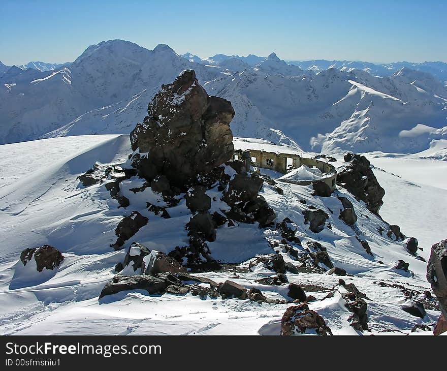 Ruins of a building in snow-covered mountains. Ruins of a building in snow-covered mountains