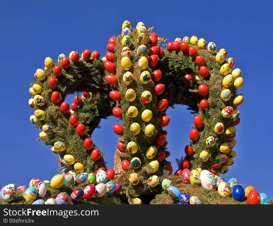 Hand painted easter eggs in a decoration with green branches