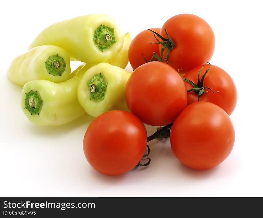 Peppers and tomatoes isolated on white background. Peppers and tomatoes isolated on white background