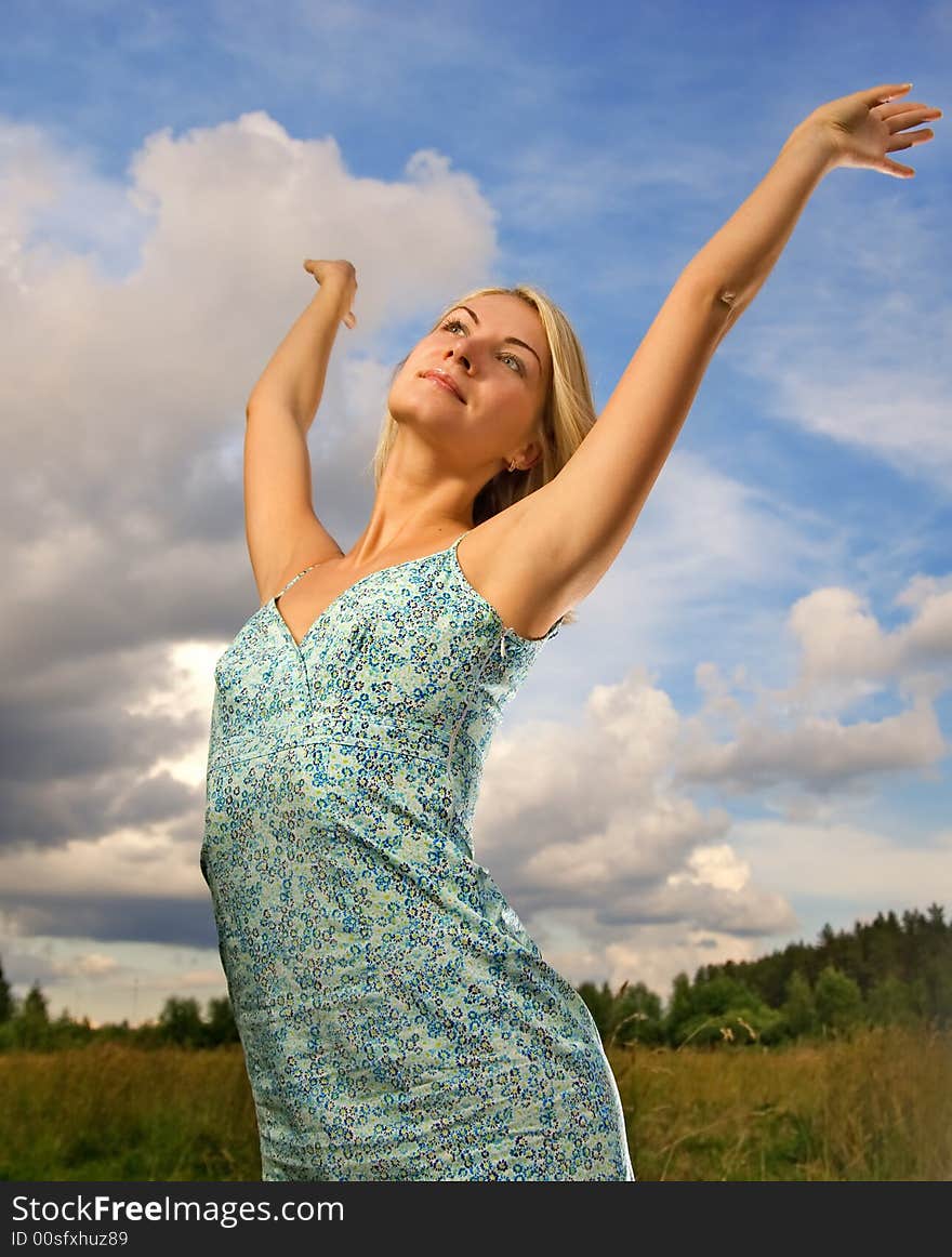 Woman over blue cloudy sky