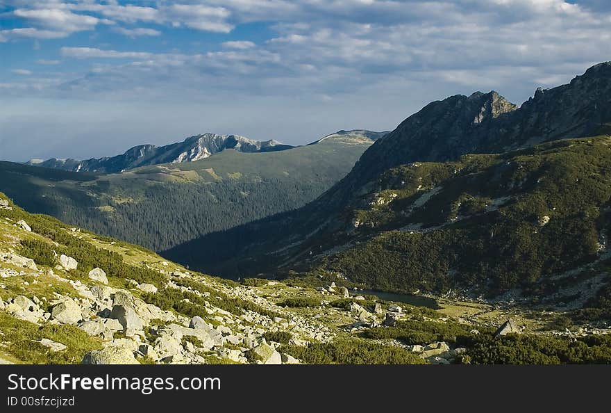 Background natural Great mountain landscape with white clouds and deep blue sky. Background natural Great mountain landscape with white clouds and deep blue sky