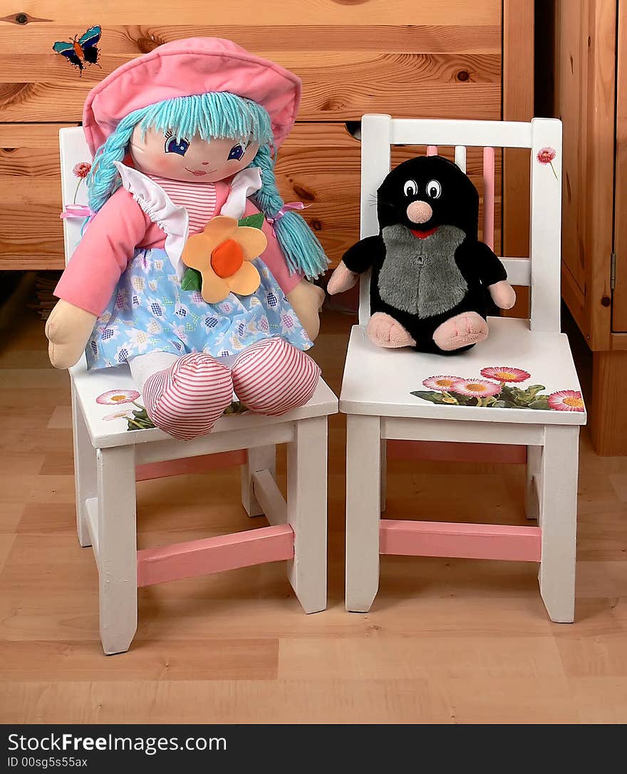 Two baby dummies sitting on baby chairs. Two baby dummies sitting on baby chairs