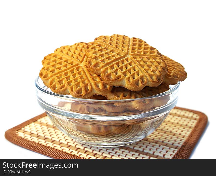 Isolated sweet cookies in the transparent plate