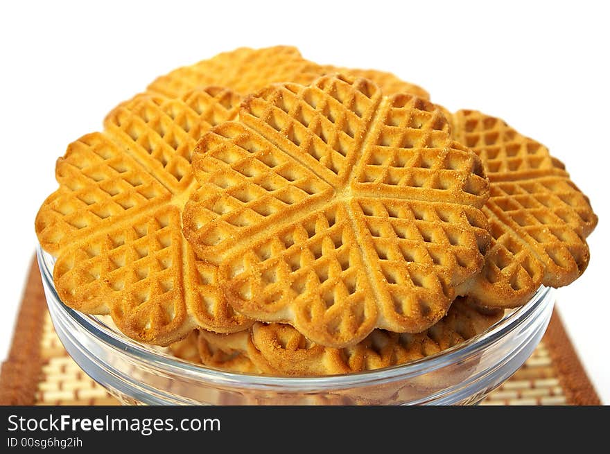 Isolated sweet cookies in the transparent plate