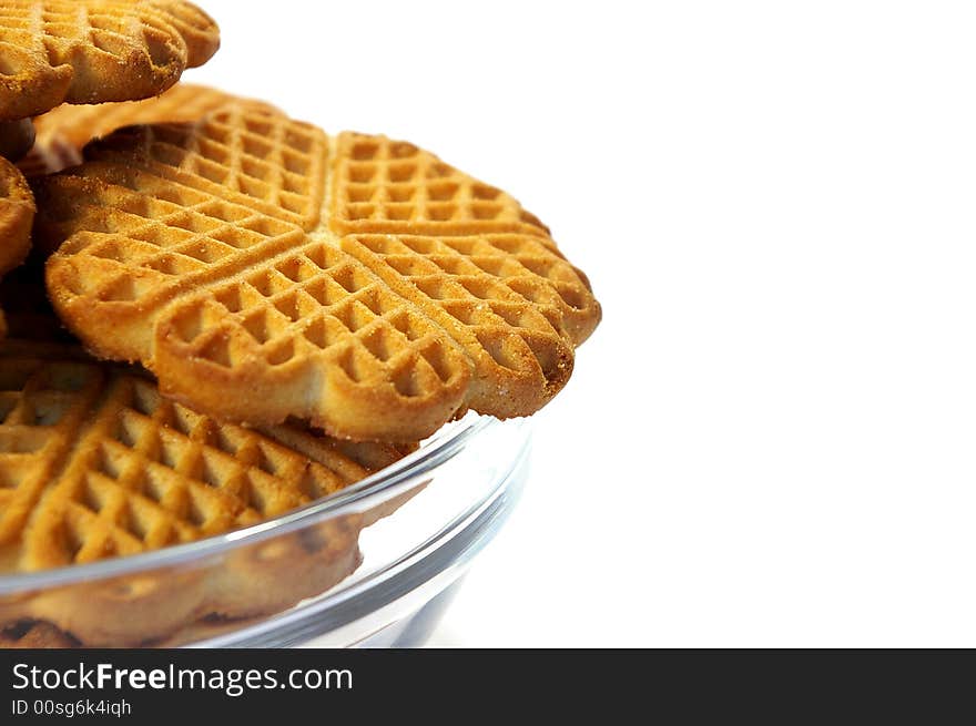 Isolated sweet cookies in the transparent plate