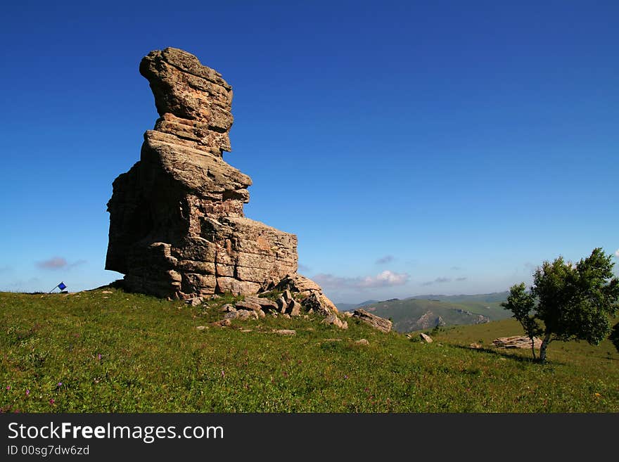 This is the stone forest in Keshiketeng Banner, inner-mongolia china. In each hill, there are many bits and pieces of stones on it. This is the stone forest in Keshiketeng Banner, inner-mongolia china. In each hill, there are many bits and pieces of stones on it.