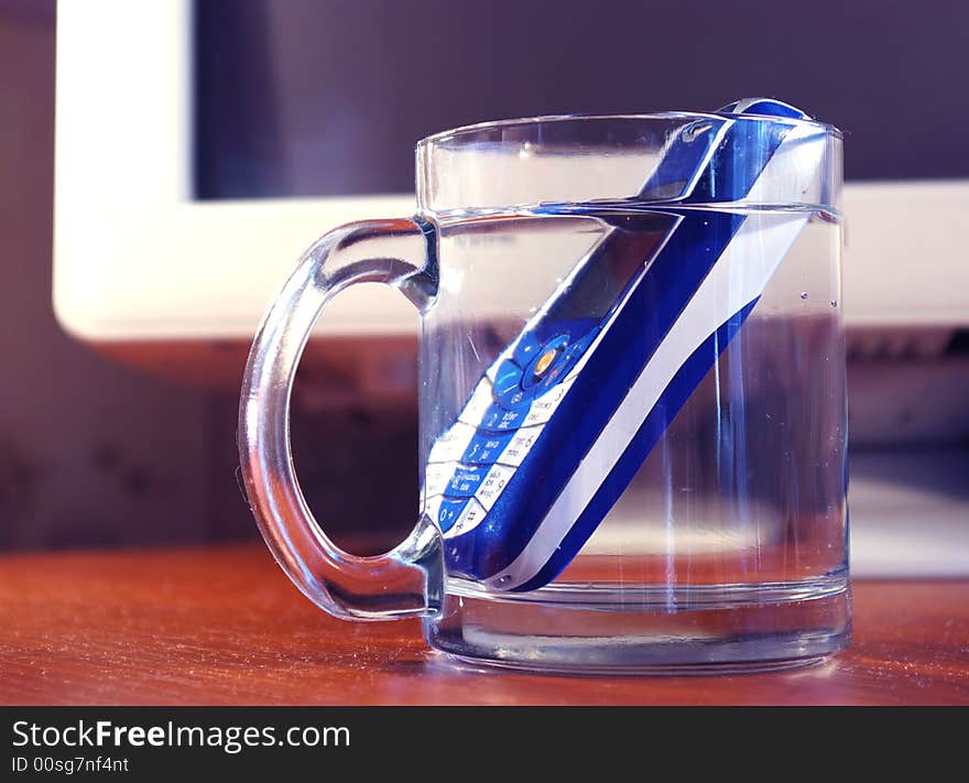 Mobile Phone In The  Glass Of Water