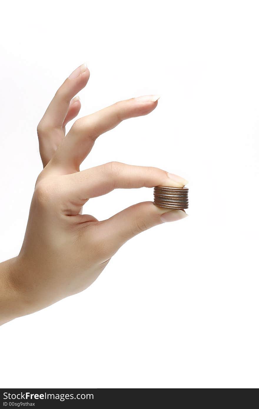 Coins in woman fingers over white background