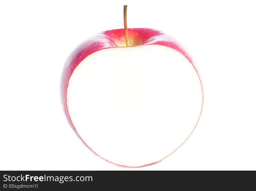 Center inch section of a red apple. White background for copyspace. Center inch section of a red apple. White background for copyspace