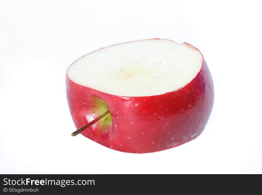 Center inch section of a red apple. White background for copyspace. Center inch section of a red apple. White background for copyspace