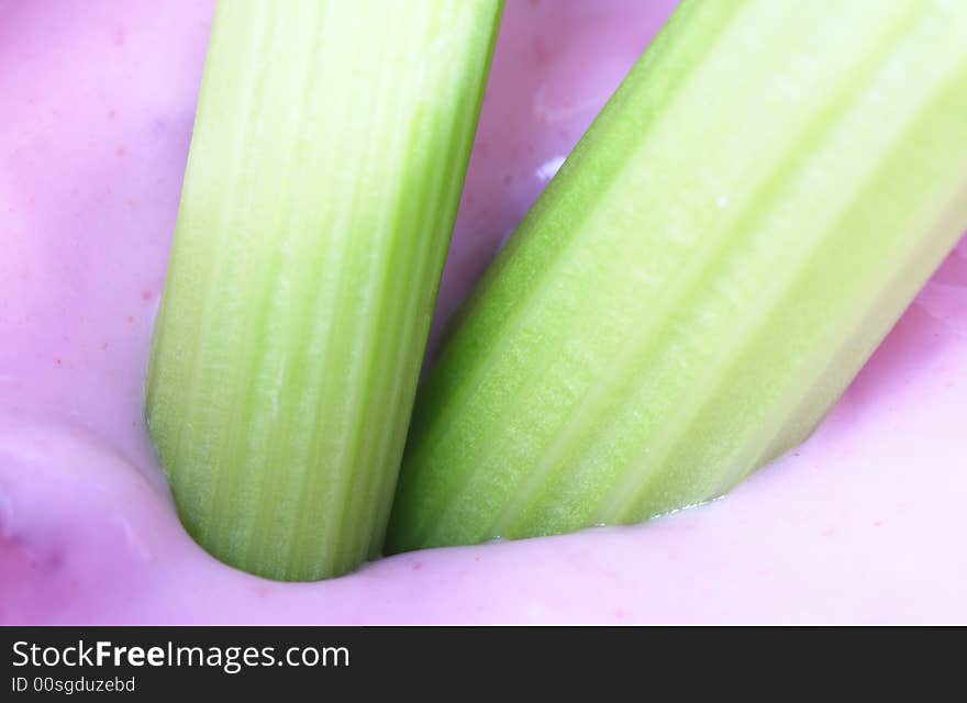 Celery Dipped in yogurt making a healthy snack