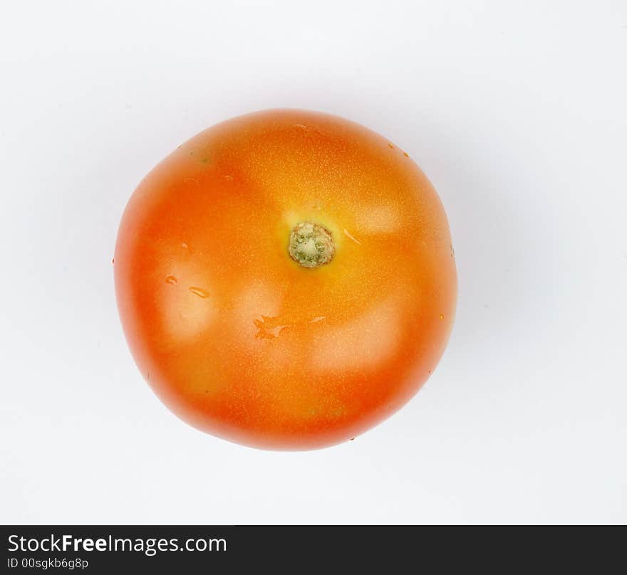 Tomato close up with water droplet on it